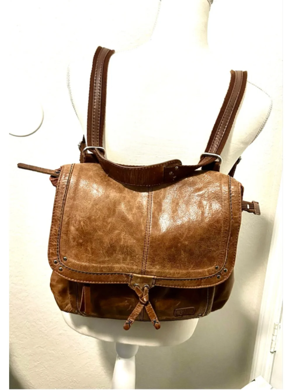 The Sak Ventura Leather Convertible Backpack in a brown, distressed leather
